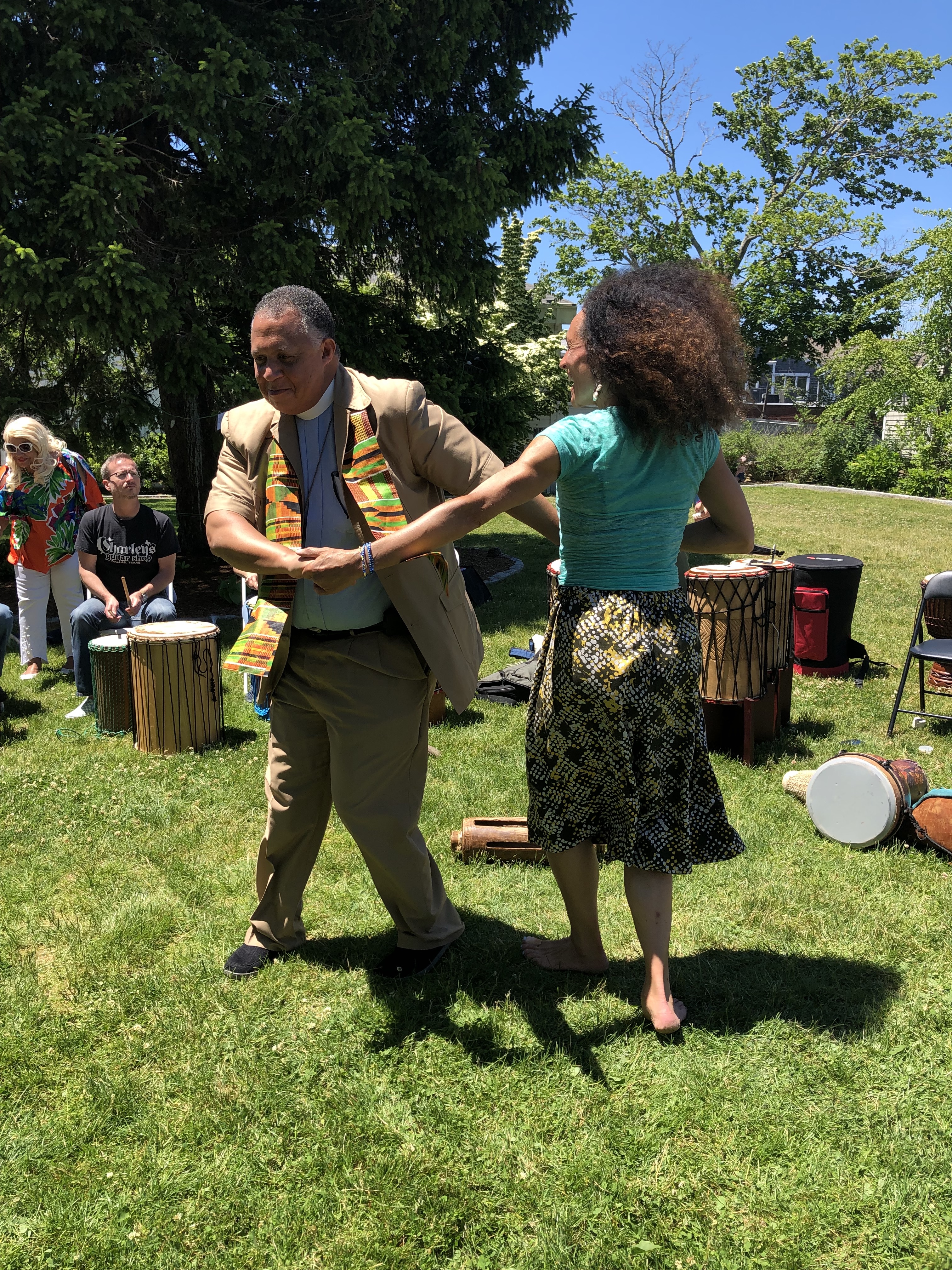 IMG_1318 Rev. Will Mebane of St. Barnabas Episcopal Church in Falmouth with Tara Murphy of Ammaya Dance and Drum (formerly known as Cape Cod African Dance and Drum) during the 2019 Juneteenth Celebration.